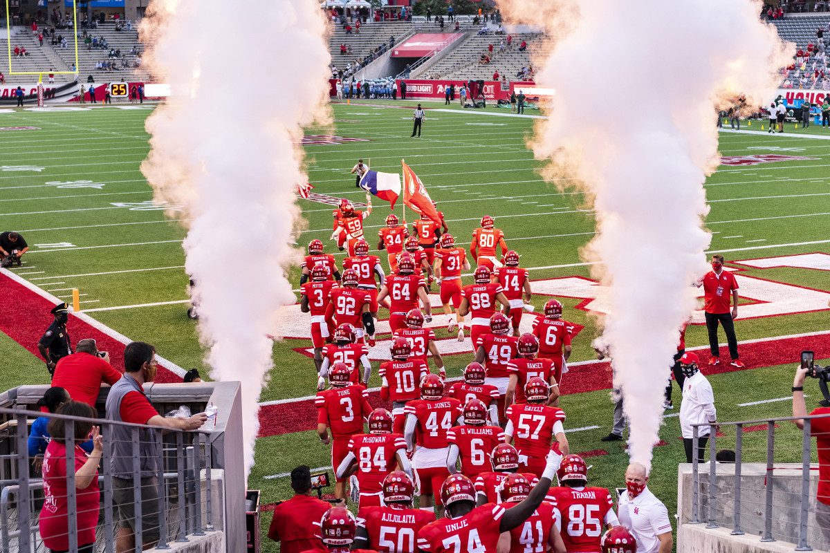 Houston football runs onto the field